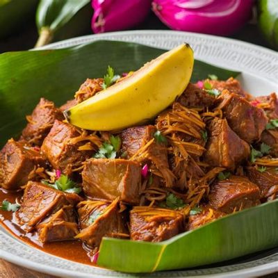  ¡Cochinita Pibil! Un manjar de carne de cerdo marinada y cocinada lentamente bajo tierra en una hoja de plátano.