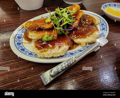  Guobaorou ¿Un plato crujiente y delicioso que te transportará a las calles de Chaoyang?