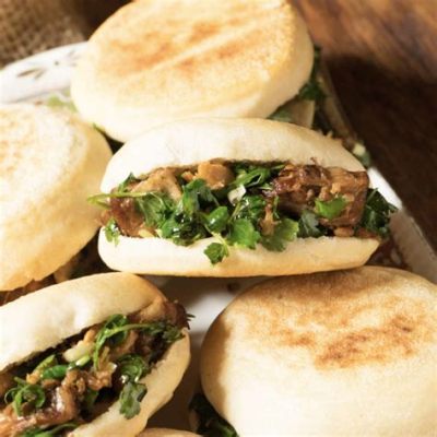  ¿Has probado el delicioso Rou Jia Mo con su increíble combinación de carne jugosa y pan crujiente?